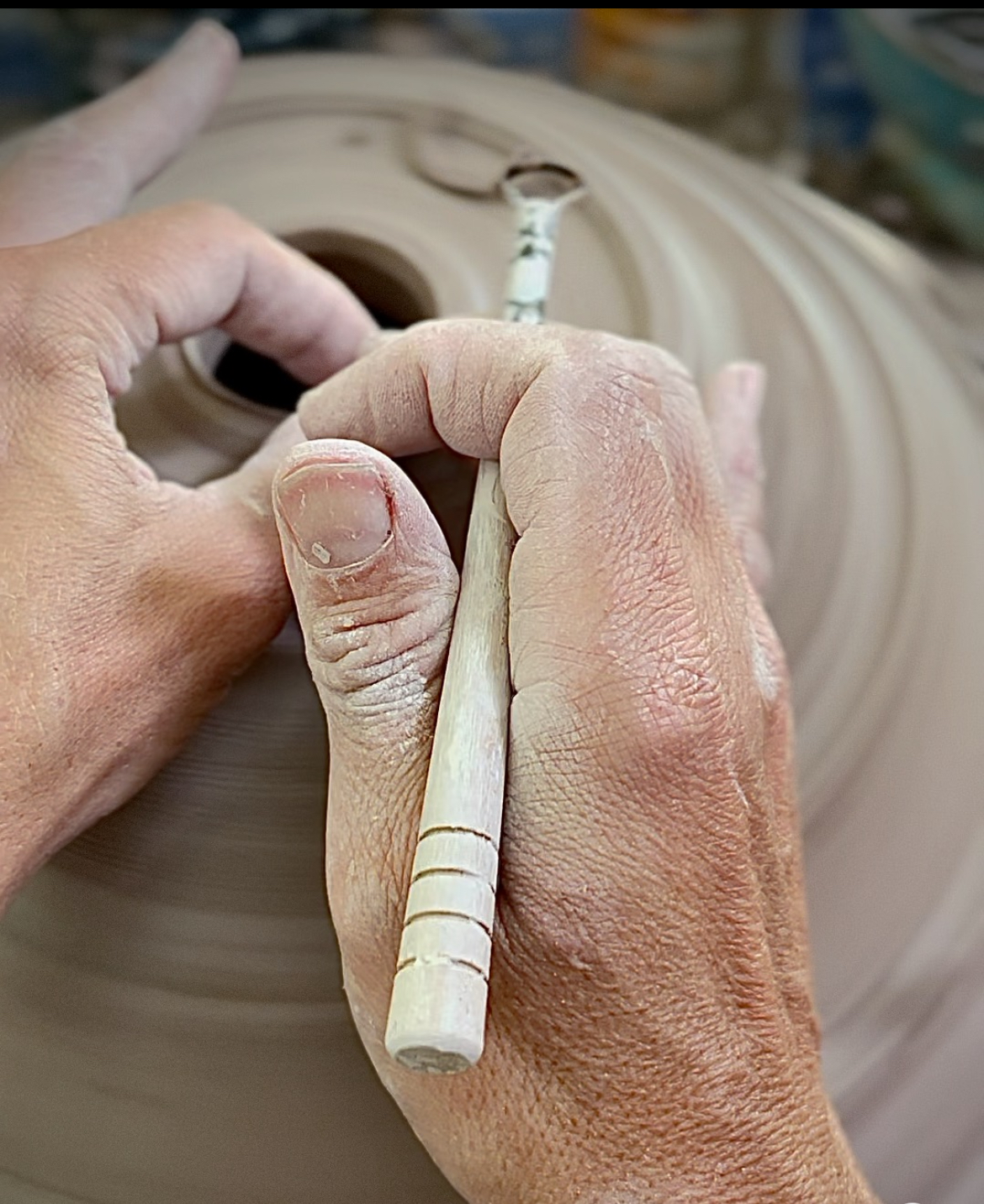 Sarah's hands sculpting